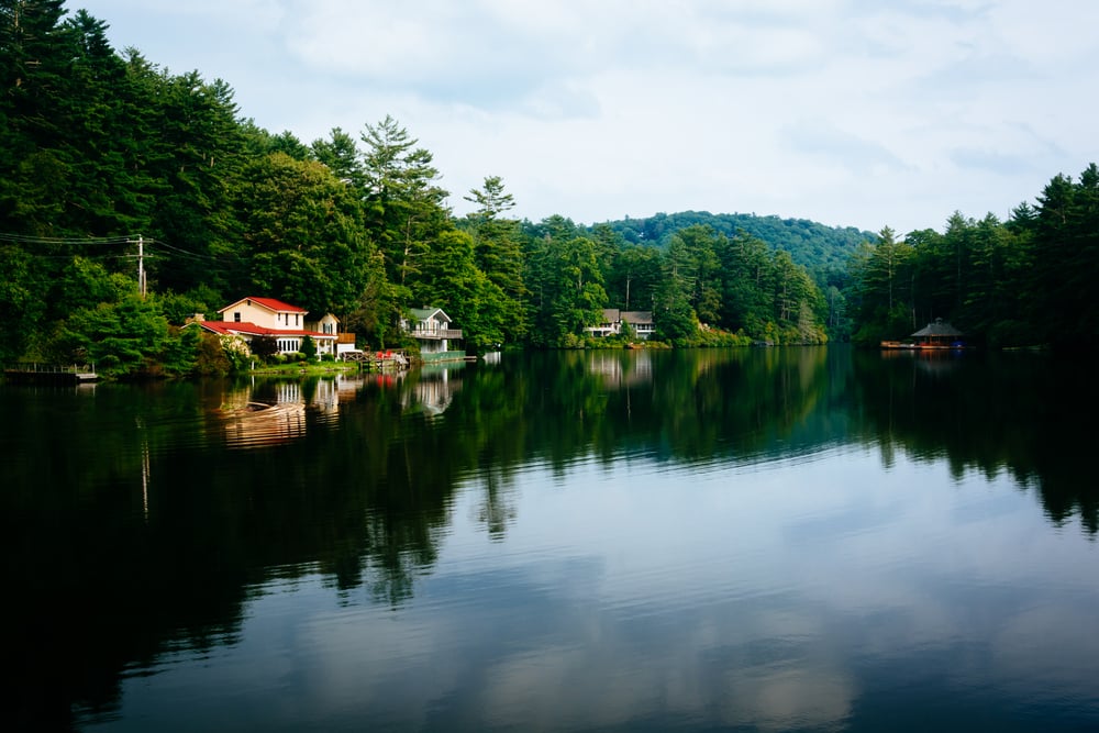 Trees and houses reflecting in Lake Sequoyah, Highlands, North Carolina. Trees and houses reflecting in Lake Sequoyah, Highlands, North Carolina.