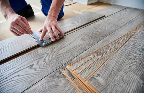 man laying down hardwood